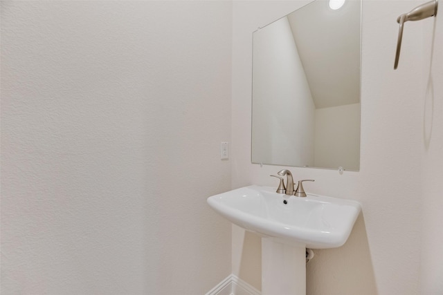 7107 Manhattan Dr, Rowlett, TX 75088 - bathroom with baseboards and a sink