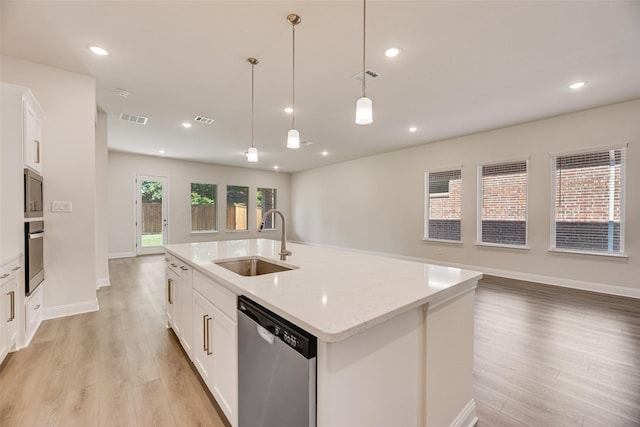 7107 Manhattan Dr, Rowlett, TX 75088 - kitchen with a sink, stainless steel appliances, open floor plan, light wood-style flooring, and recessed lighting