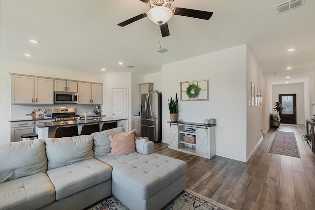 1701 Lake Grove Dr, Little Elm, TX 75068 - living area with wood finished floors, a ceiling fan, recessed lighting, and baseboards
