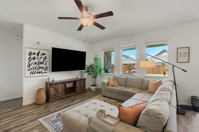 1701 Lake Grove Dr, Little Elm, TX 75068 - living area with wood finished floors, ceiling fan, and baseboards