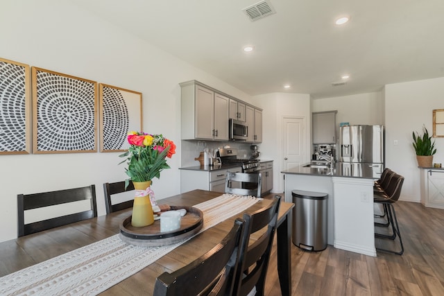 1701 Lake Grove Dr, Little Elm, TX 75068 - dining area featuring dark wood-style flooring and recessed lighting