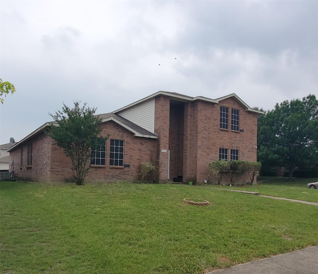 1034 Blackberry Trl, Lancaster, TX 75134 - view of front of property with brick siding and a front yard