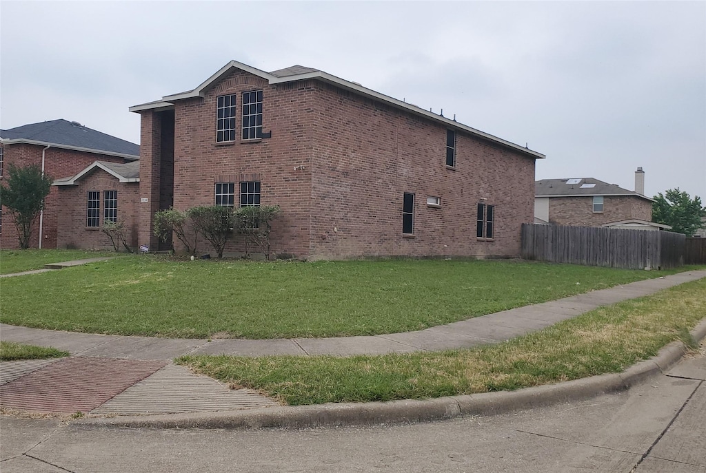 1034 Blackberry Trl, Lancaster, TX 75134 - view of side of home featuring brick siding