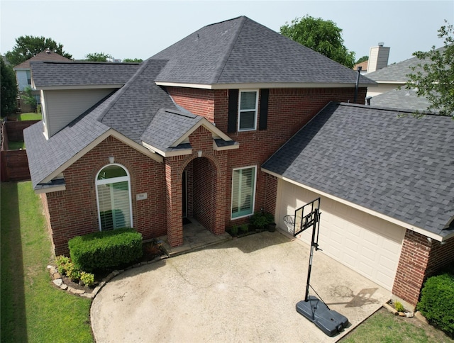 708 W Lonesome Dove Trl, Arlington, TX 76001 - view of front of house featuring a shingled roof, brick siding, concrete driveway, and a front yard
