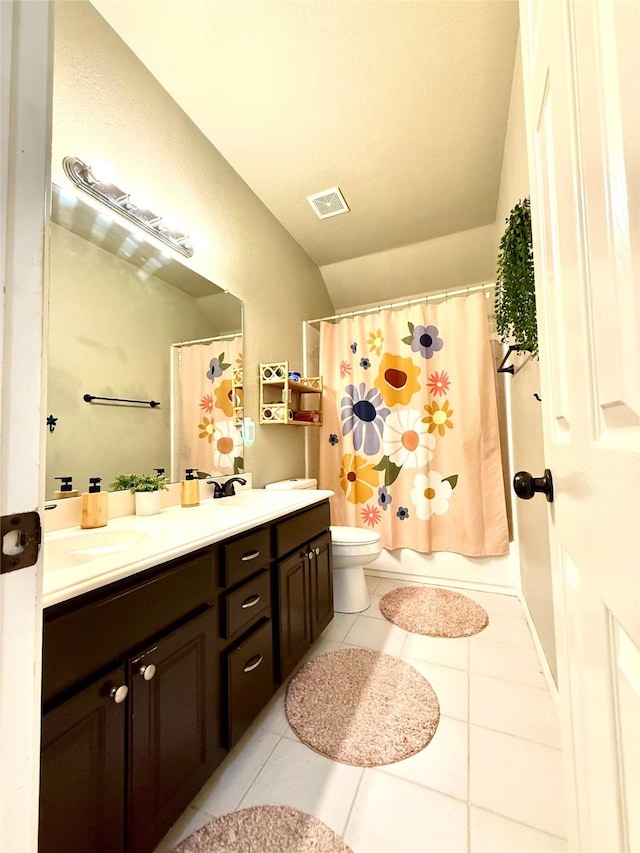 708 W Lonesome Dove Trl, Arlington, TX 76001 - bathroom with tile patterned flooring, double vanity, toilet, and a shower with curtain