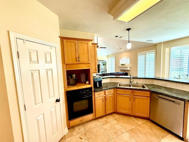 708 W Lonesome Dove Trl, Arlington, TX 76001 - kitchen featuring dishwasher, a sink, oven, a fireplace, and pendant lighting