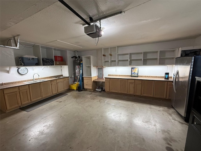708 W Lonesome Dove Trl, Arlington, TX 76001 - garage featuring freestanding refrigerator, a sink, a garage door opener, and water heater