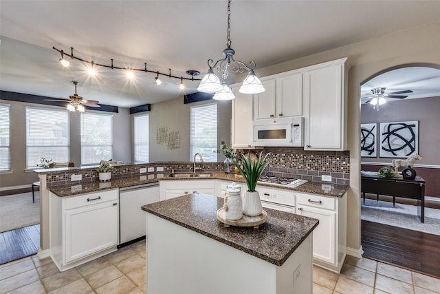 851 Sibyl Ln, Prosper, TX 75078 - kitchen with a ceiling fan, a sink, white appliances, a peninsula, and white cabinets