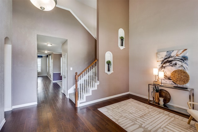 851 Sibyl Ln, Prosper, TX 75078 - entrance foyer featuring a towering ceiling, hardwood / wood-style floors, baseboards, stairs, and arched walkways