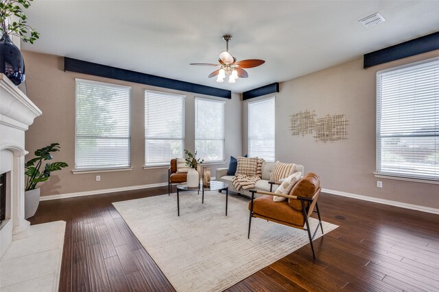 851 Sibyl Ln, Prosper, TX 75078 - living area featuring ceiling fan, a glass covered fireplace, baseboards, and dark wood finished floors