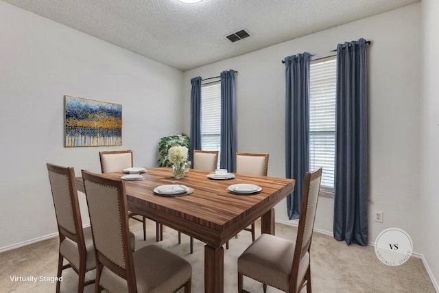3717 Drew Dr, Frisco, TX 75035 - dining area with light carpet, baseboards, and a textured ceiling