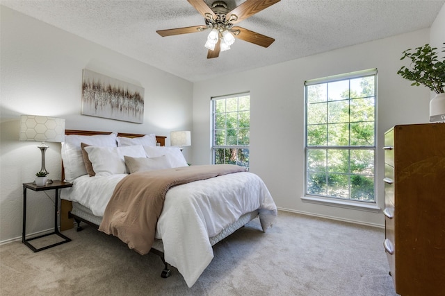 3717 Drew Dr, Frisco, TX 75035 - bedroom featuring carpet, a textured ceiling, baseboards, and ceiling fan