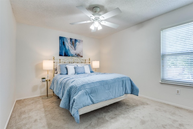 3717 Drew Dr, Frisco, TX 75035 - carpeted bedroom featuring baseboards, a textured ceiling, and ceiling fan