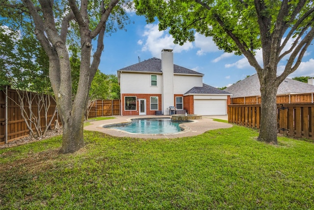 3717 Drew Dr, Frisco, TX 75035 - rear view of property with a chimney, brick siding, an attached garage, a pool with connected hot tub, and a patio area