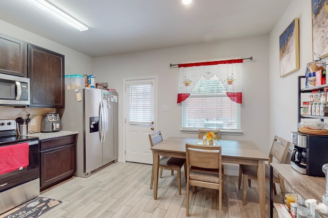 7448 Crossfire Trl, Fort Worth, TX 76112 - dining room with light wood-type flooring
