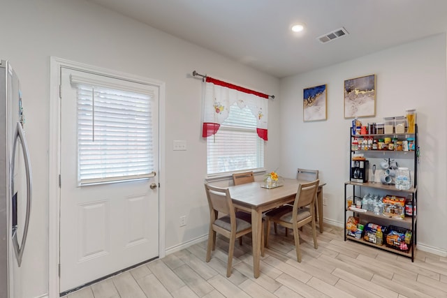 7448 Crossfire Trl, Fort Worth, TX 76112 - dining area with wood tiled floors and baseboards