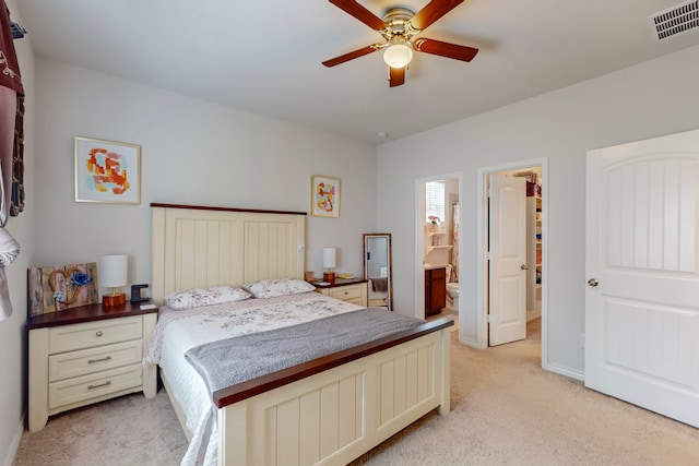 7448 Crossfire Trl, Fort Worth, TX 76112 - bedroom featuring light carpet, a ceiling fan, and ensuite bath