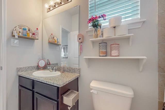 7448 Crossfire Trl, Fort Worth, TX 76112 - half bathroom featuring toilet and vanity