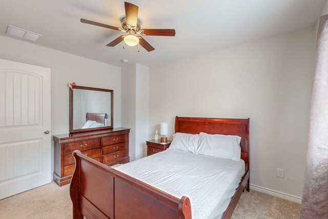 7448 Crossfire Trl, Fort Worth, TX 76112 - bedroom with light colored carpet, ceiling fan, and baseboards