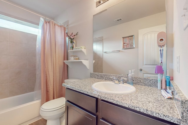 7448 Crossfire Trl, Fort Worth, TX 76112 - bathroom with toilet, vanity, and shower / bath combo