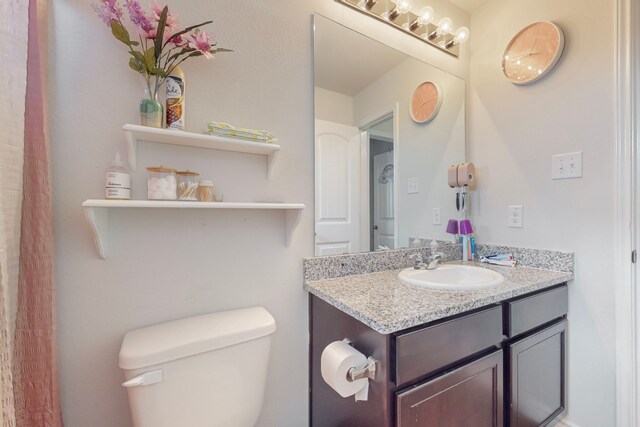 7448 Crossfire Trl, Fort Worth, TX 76112 - bathroom featuring toilet and vanity