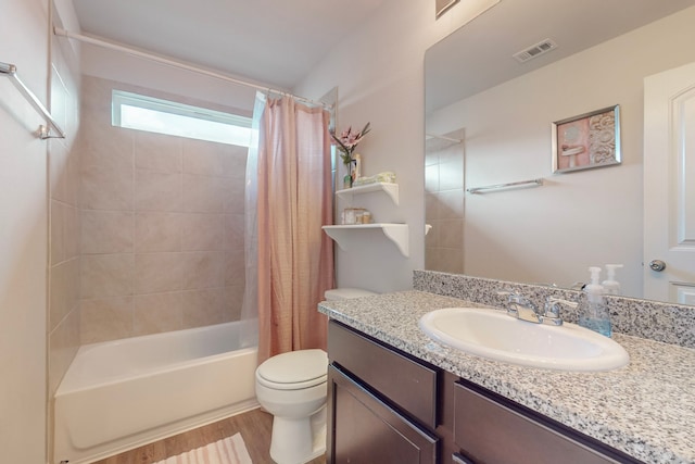7448 Crossfire Trl, Fort Worth, TX 76112 - bathroom featuring toilet, wood finished floors, shower / bath combo, and vanity