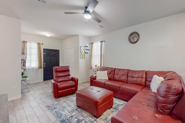 7448 Crossfire Trl, Fort Worth, TX 76112 - living area featuring a ceiling fan and baseboards