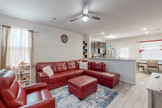 7448 Crossfire Trl, Fort Worth, TX 76112 - living area with ceiling fan and recessed lighting