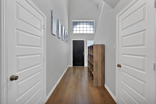 3935 Chesapeake Ln, Crandall, TX 75114 - entryway with baseboards and dark wood-type flooring