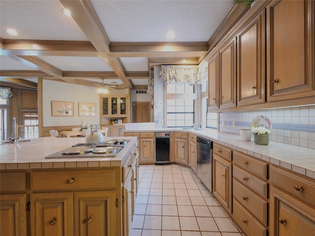 4541 Salerno Cir, Plano, TX 75093 - kitchen featuring tile countertops, appliances with stainless steel finishes, beam ceiling, a sink, and backsplash