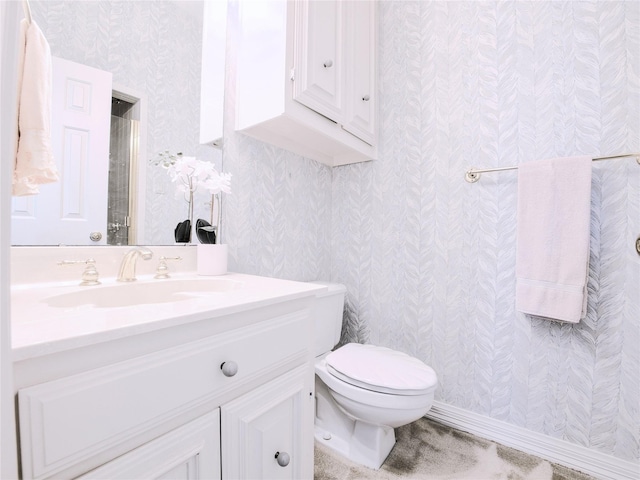 4541 Salerno Cir, Plano, TX 75093 - bathroom featuring wallpapered walls, toilet, and vanity