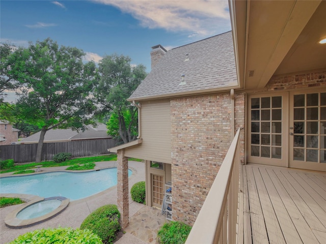 4541 Salerno Cir, Plano, TX 75093 - view of swimming pool with a fenced backyard, a wooden deck, french doors, and a pool with connected hot tub