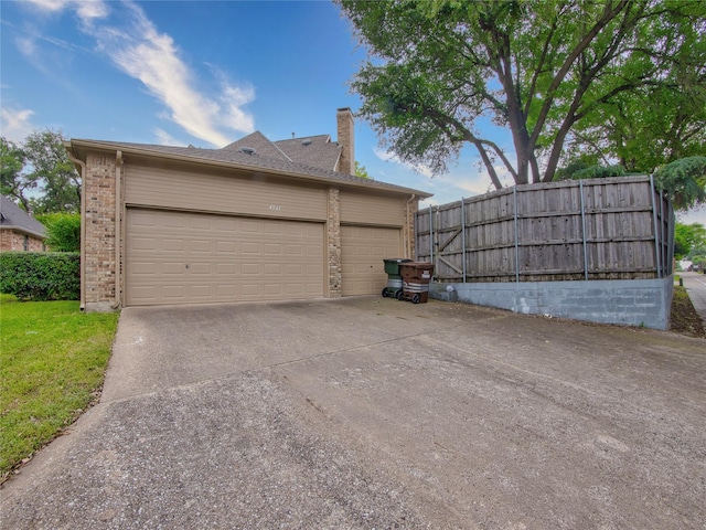 4541 Salerno Cir, Plano, TX 75093 - view of side of home featuring a chimney, brick siding, fence, and a garage
