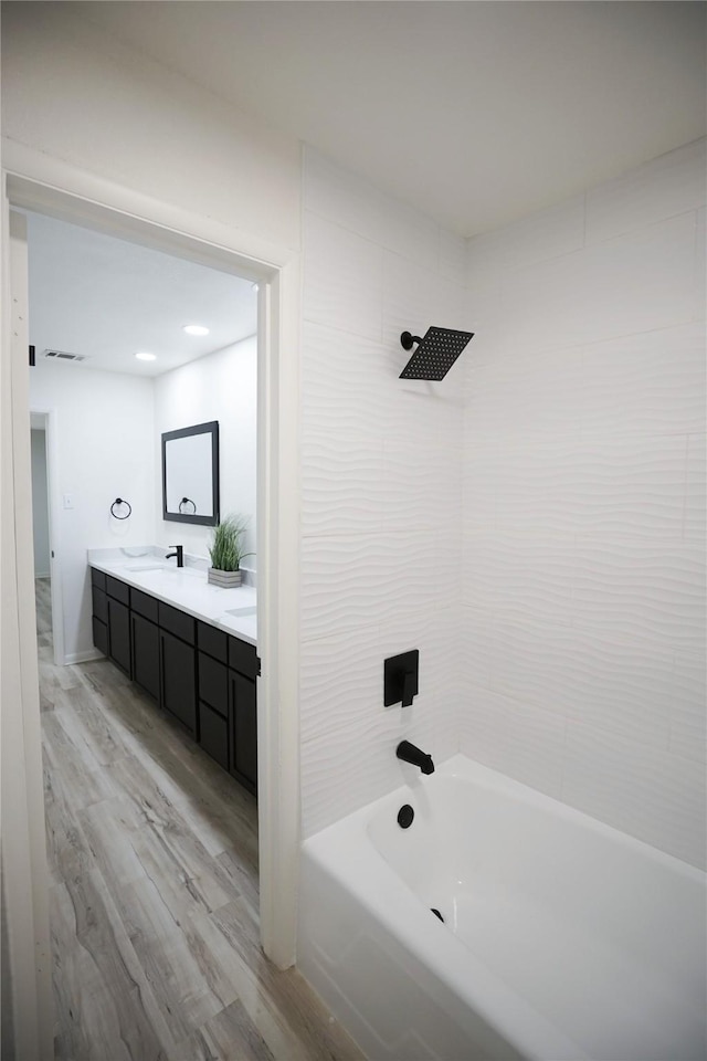 2409 Sunset Ln, Burleson, TX 76028 - full bathroom featuring wood finished floors, shower / washtub combination, and double vanity