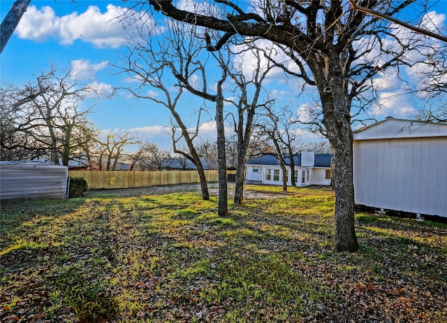 2409 Sunset Ln, Burleson, TX 76028 - view of yard with a storage shed and an outbuilding