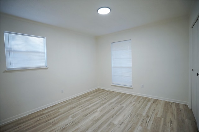 2409 Sunset Ln, Burleson, TX 76028 - empty room with light wood-style floors and baseboards