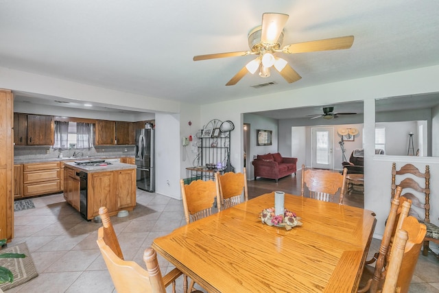 109 Honeysuckle, Paradise, TX 76073 - dining space with light tile patterned floors and ceiling fan