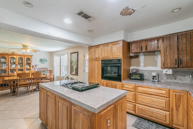 109 Honeysuckle, Paradise, TX 76073 - kitchen with oven, stainless steel gas stovetop, light tile patterned flooring, light countertops, and recessed lighting