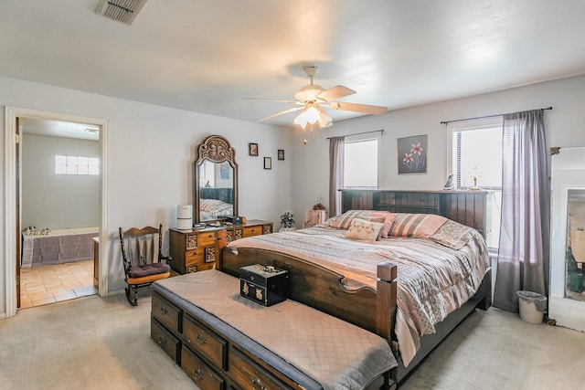 109 Honeysuckle, Paradise, TX 76073 - bedroom with light colored carpet, connected bathroom, and ceiling fan