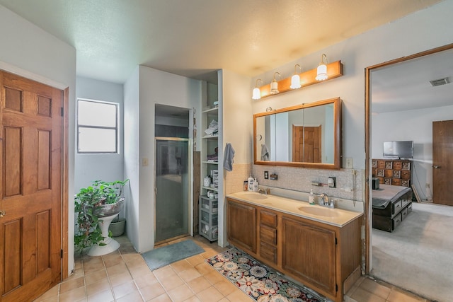 109 Honeysuckle, Paradise, TX 76073 - full bath with double vanity, tasteful backsplash, tile patterned flooring, and a stall shower