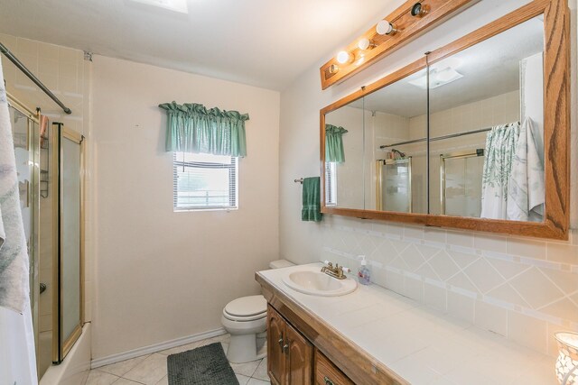 109 Honeysuckle, Paradise, TX 76073 - bathroom with backsplash, vanity, toilet, tile patterned floors, and baseboards