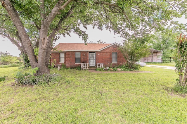 109 Honeysuckle, Paradise, TX 76073 - ranch-style home featuring a front yard and brick siding