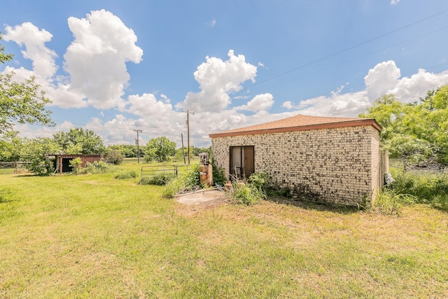 109 Honeysuckle, Paradise, TX 76073 - view of grassy yard with an outdoor structure