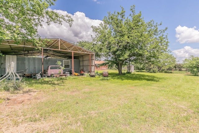 109 Honeysuckle, Paradise, TX 76073 - view of green lawn with a pole building and an outdoor structure