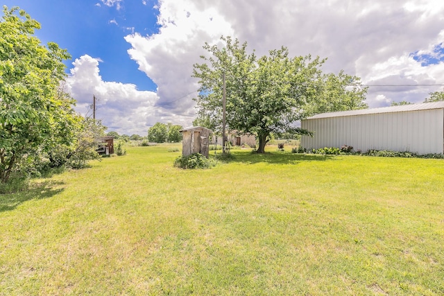 109 Honeysuckle, Paradise, TX 76073 - view of grassy yard with an outbuilding and a pole building