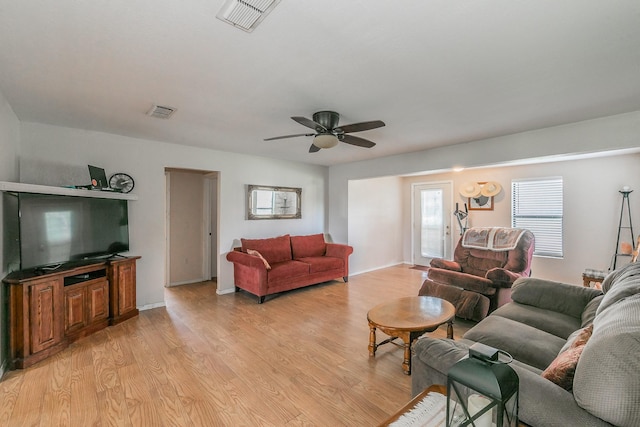 109 Honeysuckle, Paradise, TX 76073 - living room featuring light wood-style flooring, a ceiling fan, and baseboards