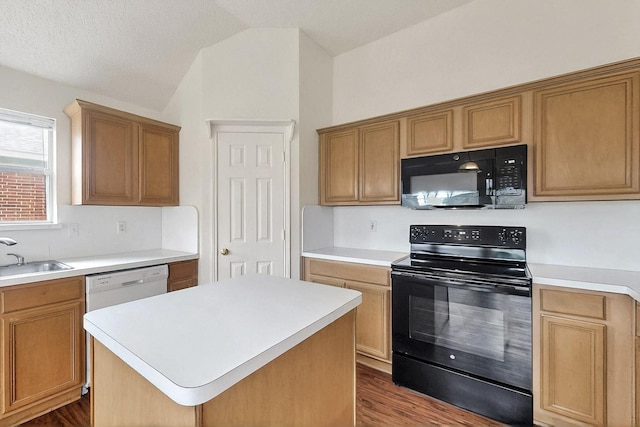 232 Cotton Wood Ct, Rockwall, TX 75032 - kitchen featuring black appliances, a sink, lofted ceiling, light countertops, and dark wood-type flooring