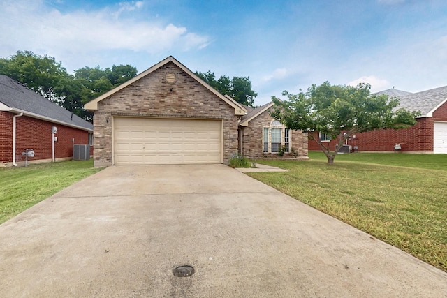 232 Cotton Wood Ct, Rockwall, TX 75032 - view of front of property featuring a front lawn, brick siding, central air condition unit, and concrete driveway