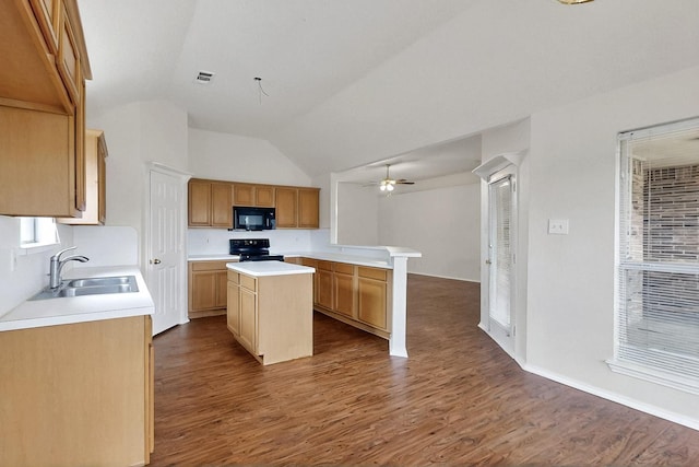 232 Cotton Wood Ct, Rockwall, TX 75032 - kitchen with black appliances, a sink, a kitchen island, light countertops, and vaulted ceiling