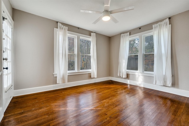 2615 W Brooklyn Ave, Dallas, TX 75211 - empty room with hardwood / wood-style floors, baseboards, and a ceiling fan